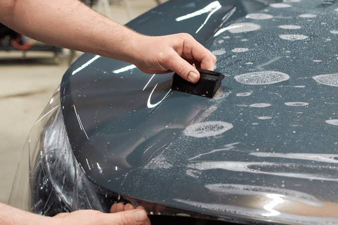 Installing transparent protection on a car hood